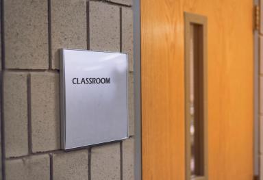 Classroom door with sign at school