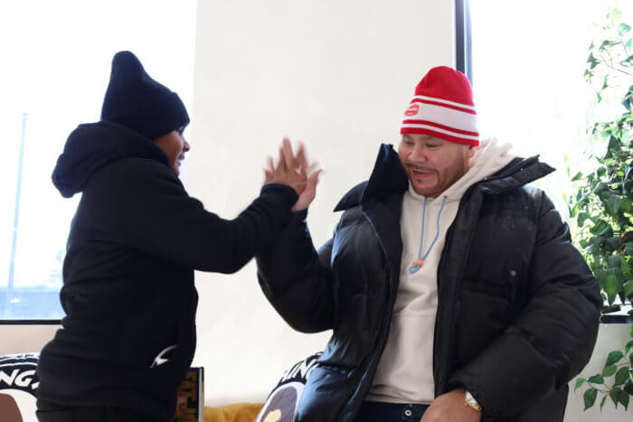 Hip Hop legend Fat Joe high fives King Singh from Queens at UP NYC in the South Bronx on Nov. 22. Fat Joe sent Singh a video message when the young boy was battling cancer in a hospital bed a few short years ago. 