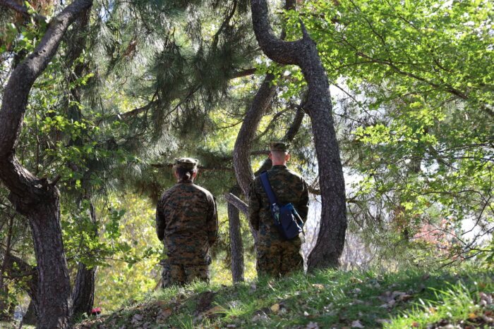 Two soldiers stand watch at the Veterans Day celebration on Nov. 13 at the Bicentennial Veteran'\s Memorial Park in Throggs Neck.