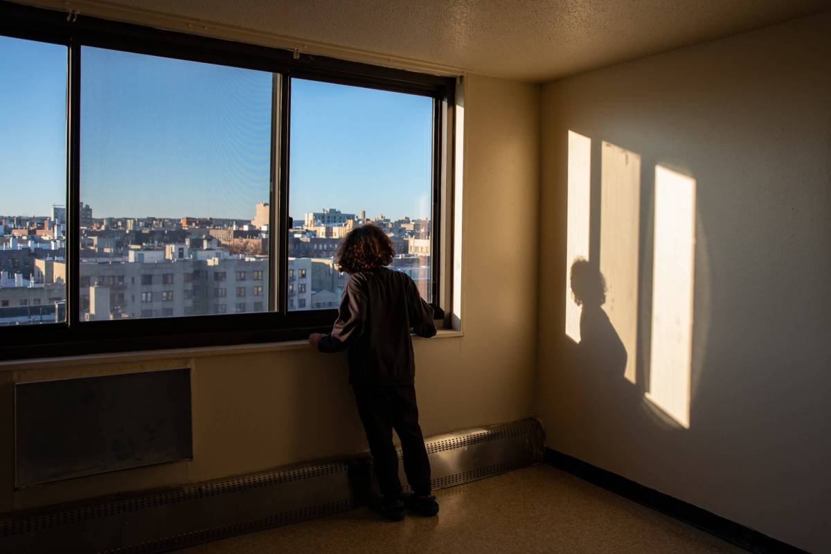Nathan, an 11-year-old Bronxite, looks out the window of his future view before moving into Twin Parks North West this month.