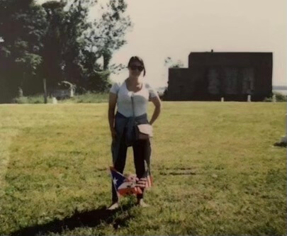 Elsie Soto is pictured here the first time she was able to visit her father's grave on Hart Island in June of 2019. Her dad was one of many New Yorkers buried on the isle during the AIDS epidemic of the 1980s and 1990s. 