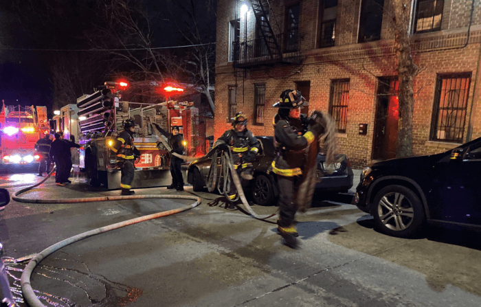 Firefighters respond to a four-alarm fire in Wakefield on Thursday, Jan. 26, 2023. 