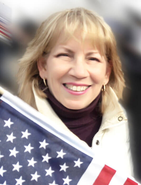 Bernadette Ferrara with an American flag