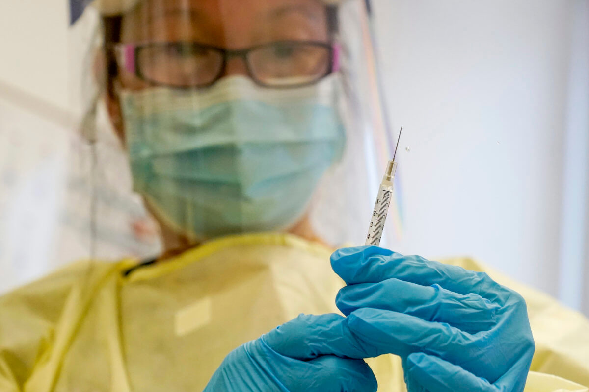medical provider holds mpox vaccine