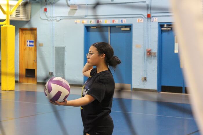 The Legacy Volleyball Club girls work on their short serves during practice in Belmont on Monday, Dec. 12, 2022.