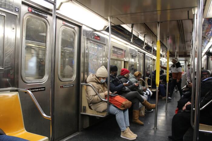 Passengers ride a Bronx-bound 1 train on Thursday, Feb. 2, 2023.