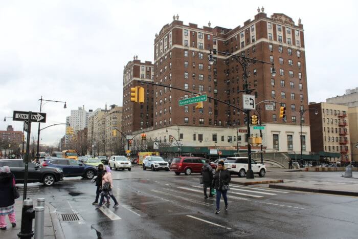 People walk along Grand Concourse in the Bronx on Friday, Feb. 17, 2023.