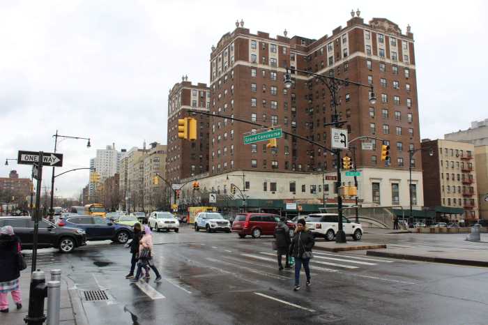 People walk along Grand Concourse in the Bronx on Friday, Feb. 17, 2023.