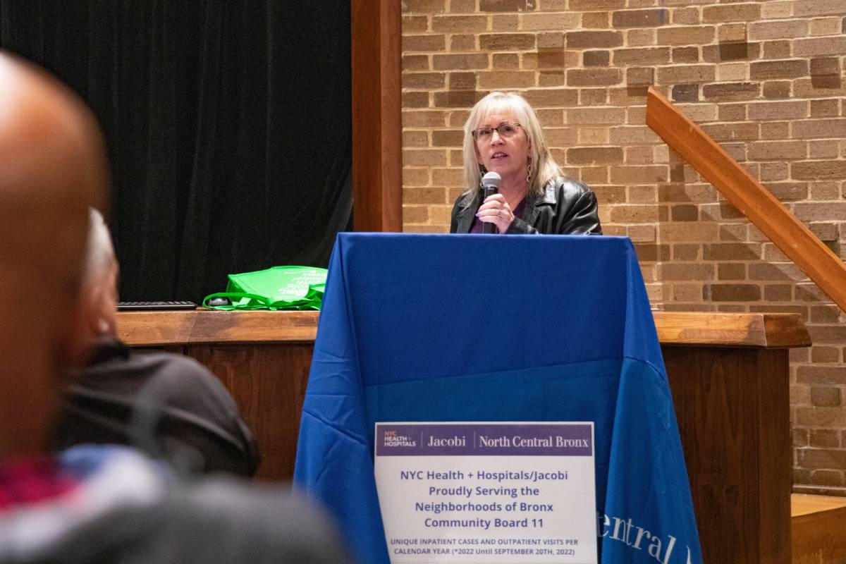 Bernadette Ferrara speaking into a microphone