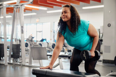a woman lifts weight