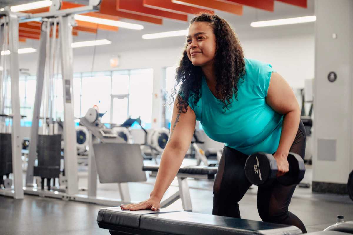 a woman lifts weight