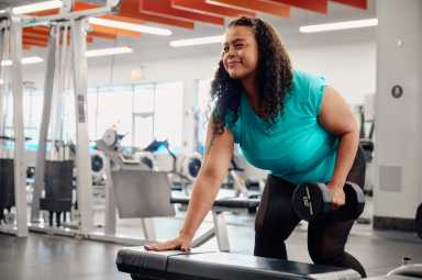 a woman lifts weight