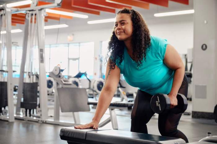 a woman lifts weight