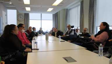 ICS and CLDR members and leadership sitting with Senator Rivera around a long table.