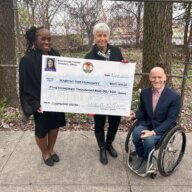 Bronx Borough President Vanessa Gibson awards a grant to the Claremont House.