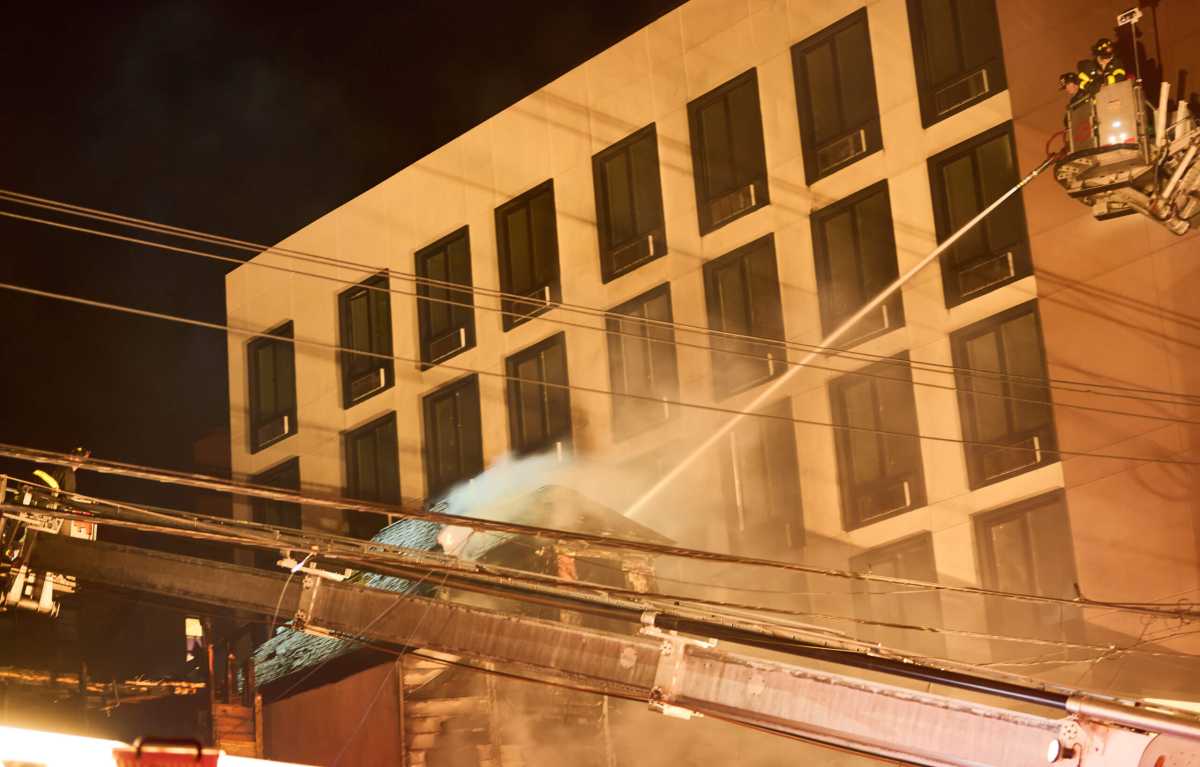 Tower Ladders 44 and 45 operates their streams to knock down heavy fire in two vacant buildings at 1041 and 1043 Odgen Avenue in the Highbridge section of the Bronx