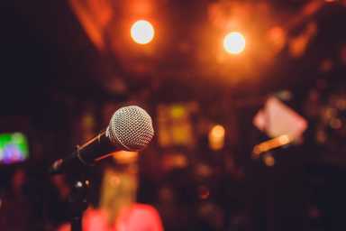 Microphone on stage bokeh comedy