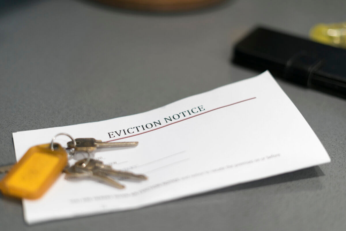 a stock photo shows keys and an eviction notice