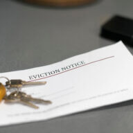 a stock photo shows keys and an eviction notice