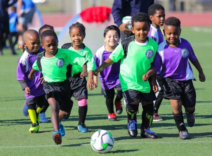 Group of little kids playing soccer for South Bronx United, a Bronx-based nonprofit.
