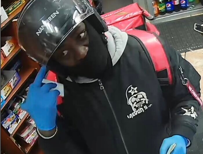 Surveillance photos show an individual after allegedly stealing a 61-year-old's purse and attempting to use her bank card in an unauthorized transaction at 85 West Fordham Road on Sunday, April 9, 2023.