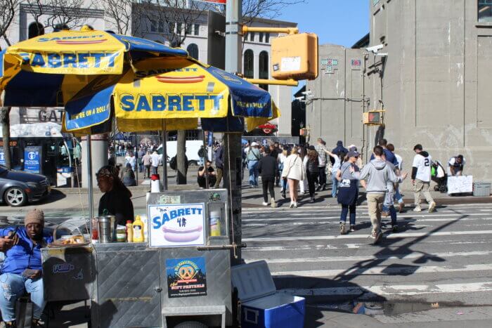 Street vendors sell food outside of Yankee Stadium on Saturday, April 1, 2023.