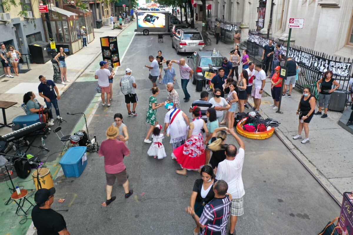 people dancing in the street