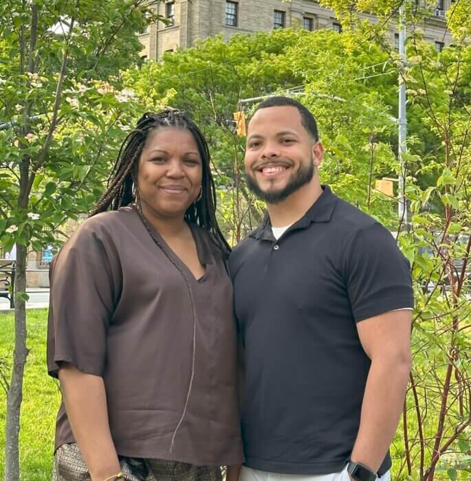 Shawanda Weems stands beside Elías Cruz in a recent photo