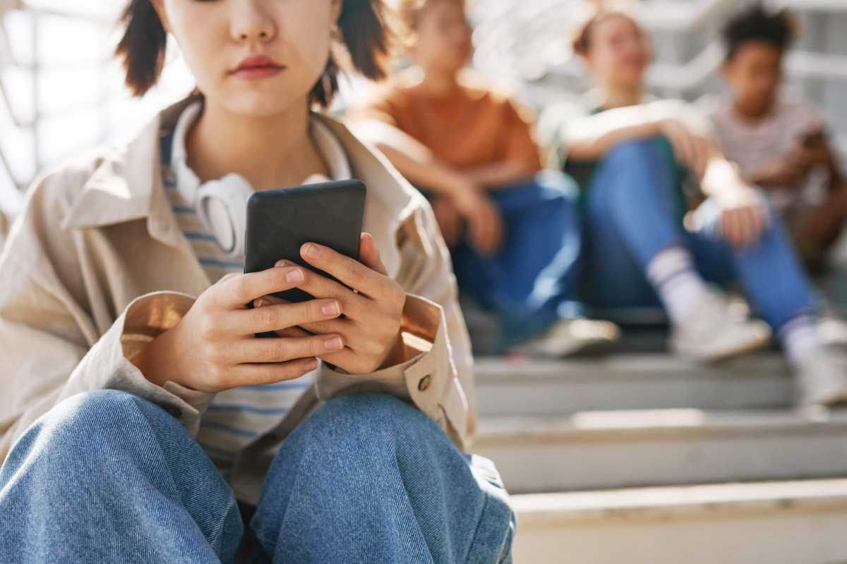 Teen Girl Waiting for Text Message