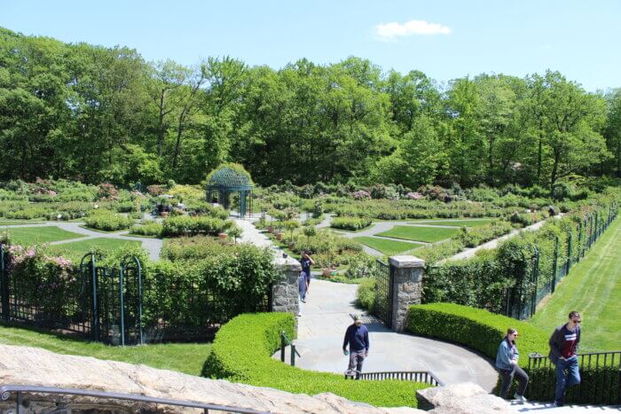 Visitors exit the Rockefeller Rose Garden at the New York Botanical Garden in the Bronx on Wednesday, May 17, 2023.