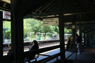 People wait for the train at the Botanical Garden Metro-North station in Bedford Park on Wednesday, May 17, 2023.