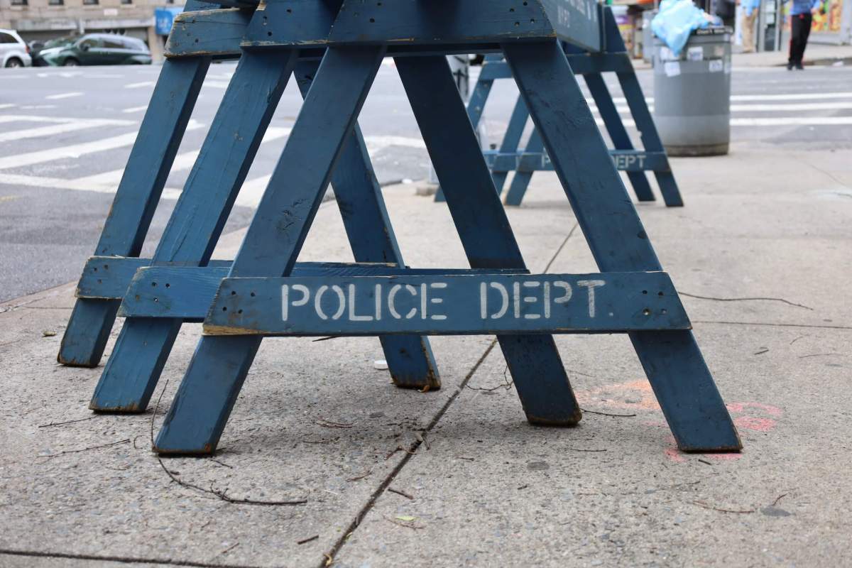 NYPD police barriers block the public.