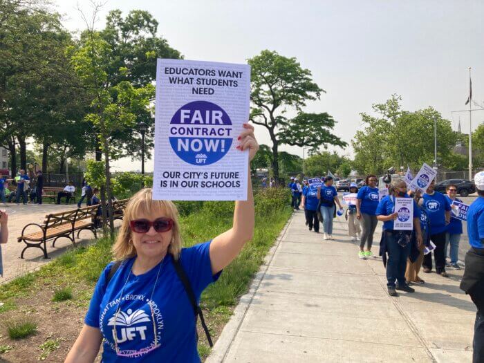 UFT members line the sidwalks to demonstrate for a 'fair' contract during a rally in Parkchester on Wednesday, May 24, 2023.
