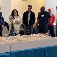 people gathered around a map of the Cross Bronx Expressway