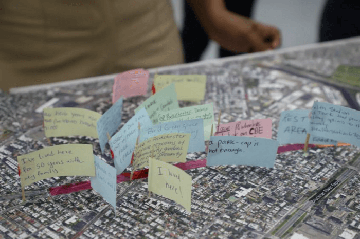 sticky notes on toothpicks on a map with comments like "I lived here!"
