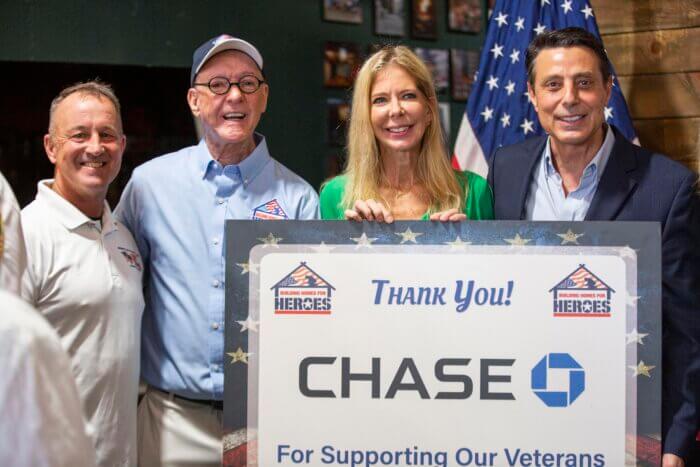 The home is being gifted by JP Morgan Chase and Building Homes for Heroes. Pictured from left to right, retired FDNY Captain Mike Alexander, Building Homes for Heroes Founder and CEO Andy Pujols, Chase Home Lending Advisor Darcie Gore and Chase Home Lending Advisor Peter Jianette.