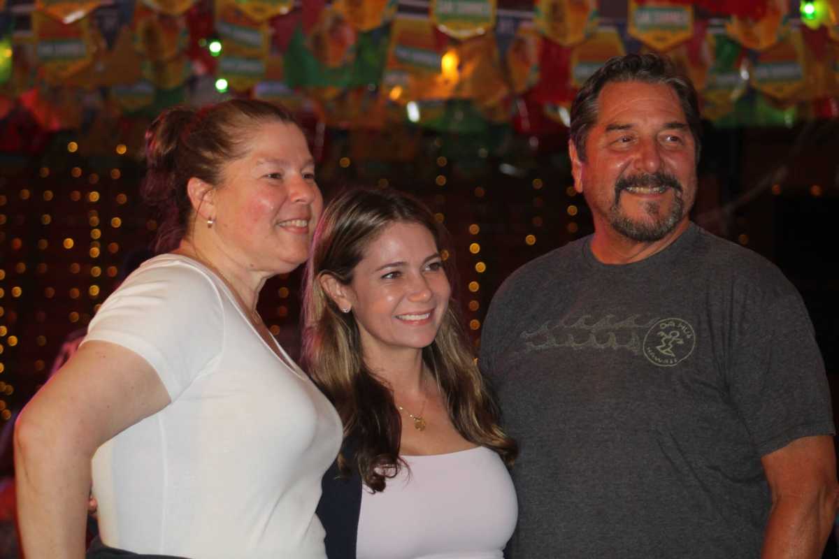 Kristy Marmorato poses between two supporters