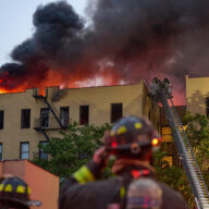 Another fire on Sunday killed one woman in the Bronx. Pictured, firefighters attempt to control a fire in the Soundview section on Sunday.