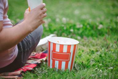 junk food popcorn soda drink ready for movie watching at open air cinema