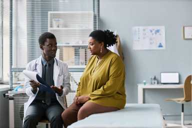 A doctor discussing medical information with their patient.