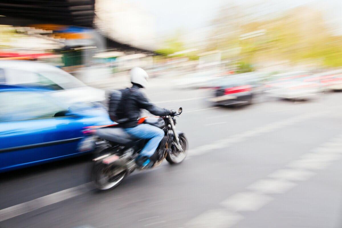 stock photo of a person riding a motorcycle