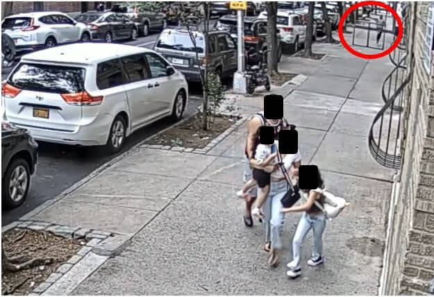 Passersby appear to flee the scene of a shooting in the Crotona Park East section of the Bronx on Friday, June 16, 2023. 