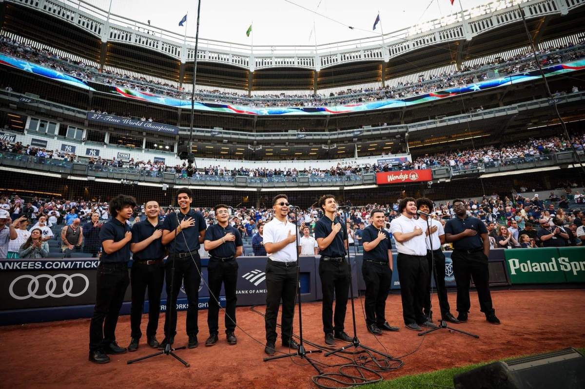 The All Hallows High School Modern Band, led by its music director Alfredo Hernandez, perform the national anthem before the New York Yankees faced off against the Seattle Marines on Tuesday, June 20, 2023.