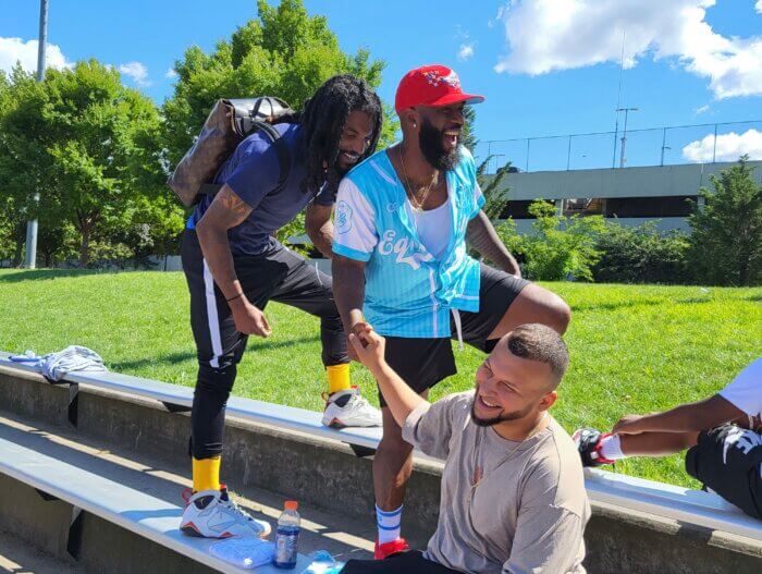 From left to right, former NFL wide receiver Kevin Ogletree, Kyle Thomas and Jariel Cedeno strategize before the game on Sunday, July 30, 2023. 