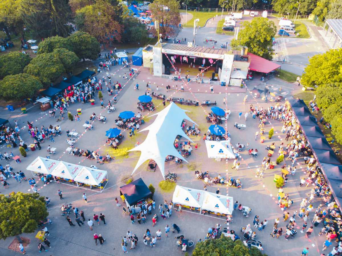 The public enjoys an outdoor concert.