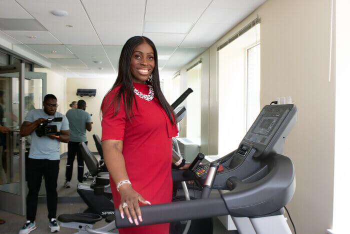 Vanessa Gibson poses on a treadmill