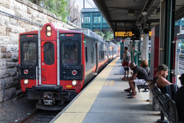 Passengers wait for the Metro-North in July 2023.