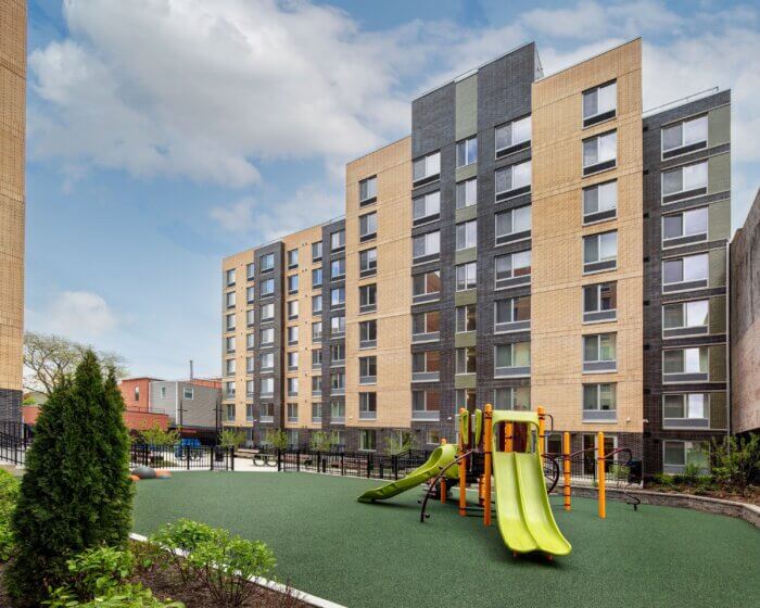 image of the new building and a playground outside