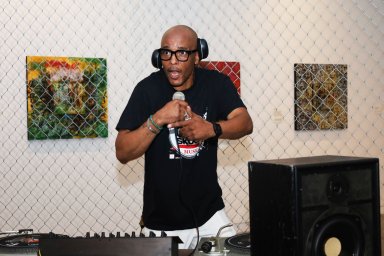 Bronx-native and self-proclaimed Hip Hop pioneer, G-Rush, takes advantage of the selfie portion of the "Two Turntables and a Microphone" exhibit with the art piece titled "Boodie Down."