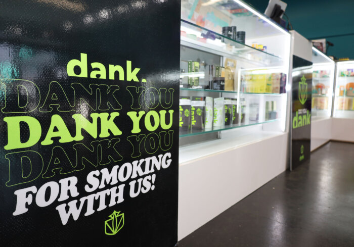 a decal inside the dispensary says "Dank. Dank you Dank you Dank you for smoking with us!"